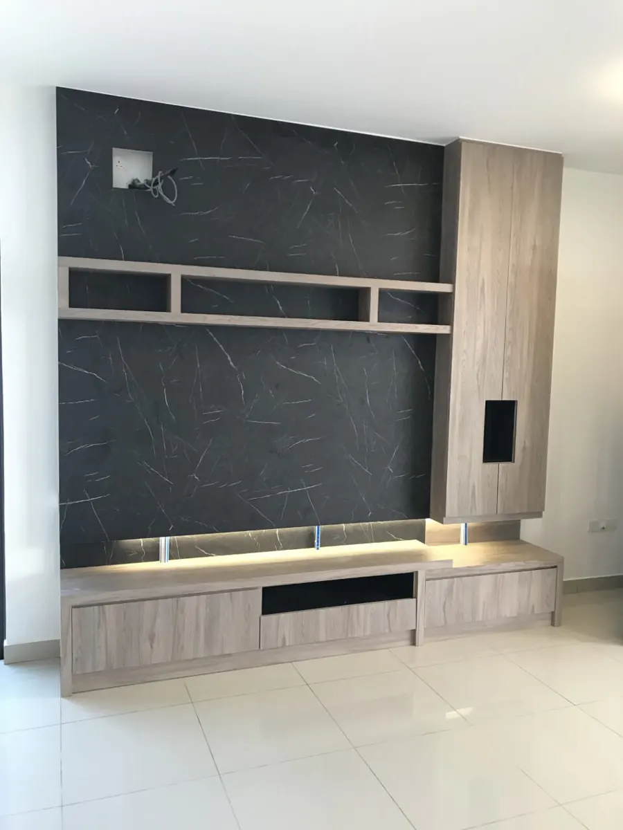 Built-in TV feature wall with a dark marble-look panel, open shelf, wood-grain tall cabinet and lit TV console