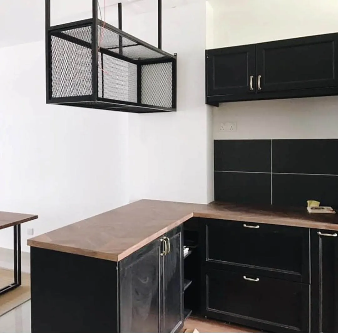 Kitchen we built with black shaker cabinets and a dark walnut-look laminate top in an L shape